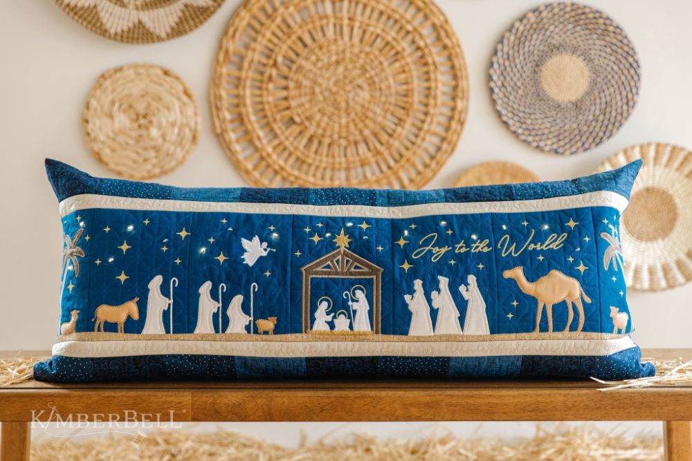 https://www.whistlebearquilts.com/cdn/shop/files/KDKB1279-Nativity-Bench-Pillow-Webres-2.jpg?v=1690150275&width=1445